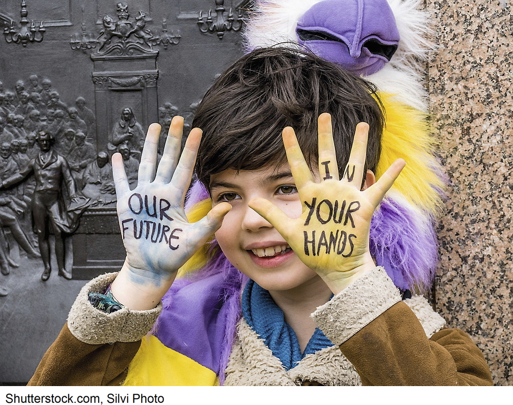 a boy with the slogan "Our future - in your hands"